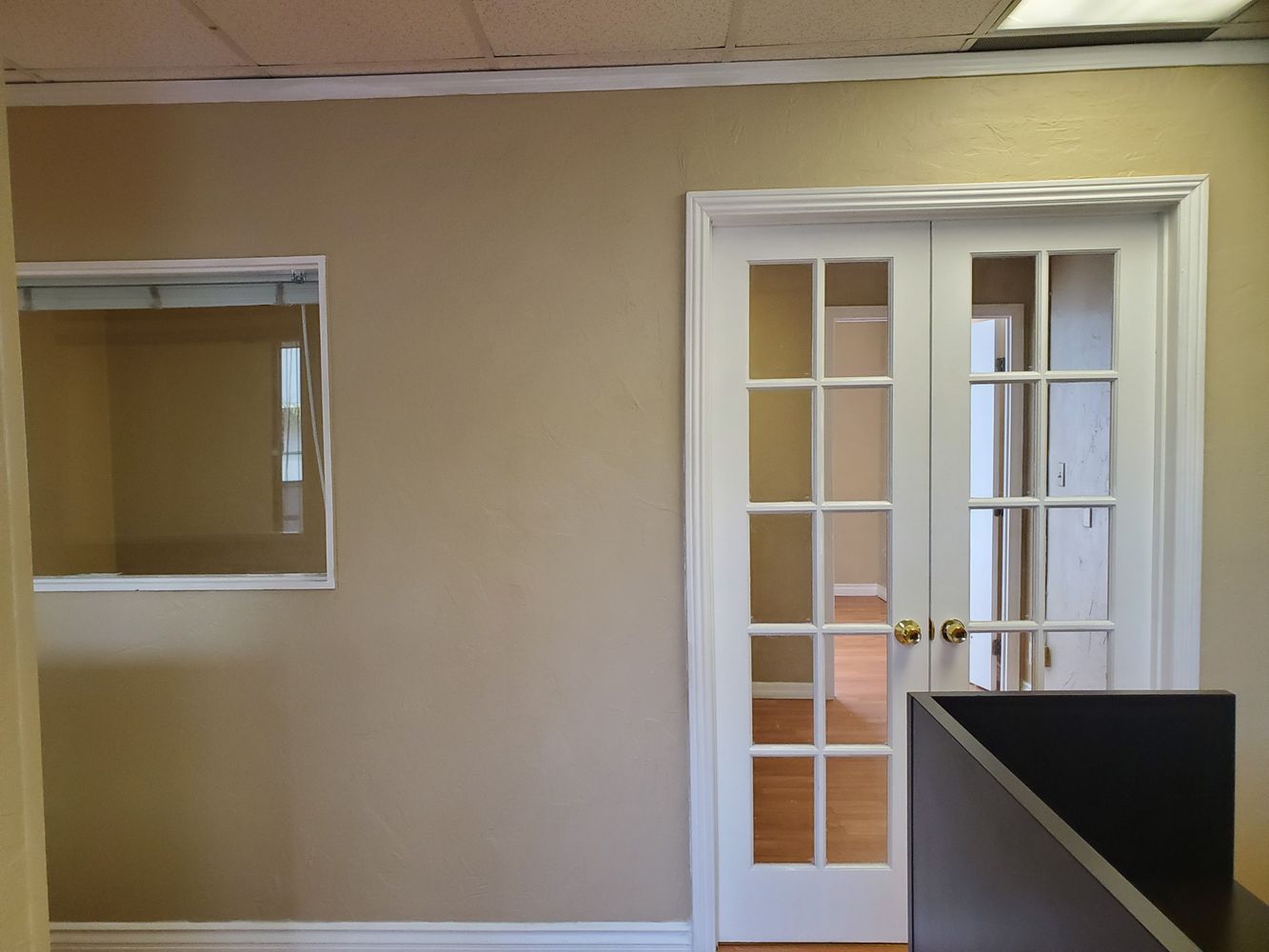 TILE AND WOOD FLOOR RECEPTION AREA. 5 OFFICES AND LARGE ROOM